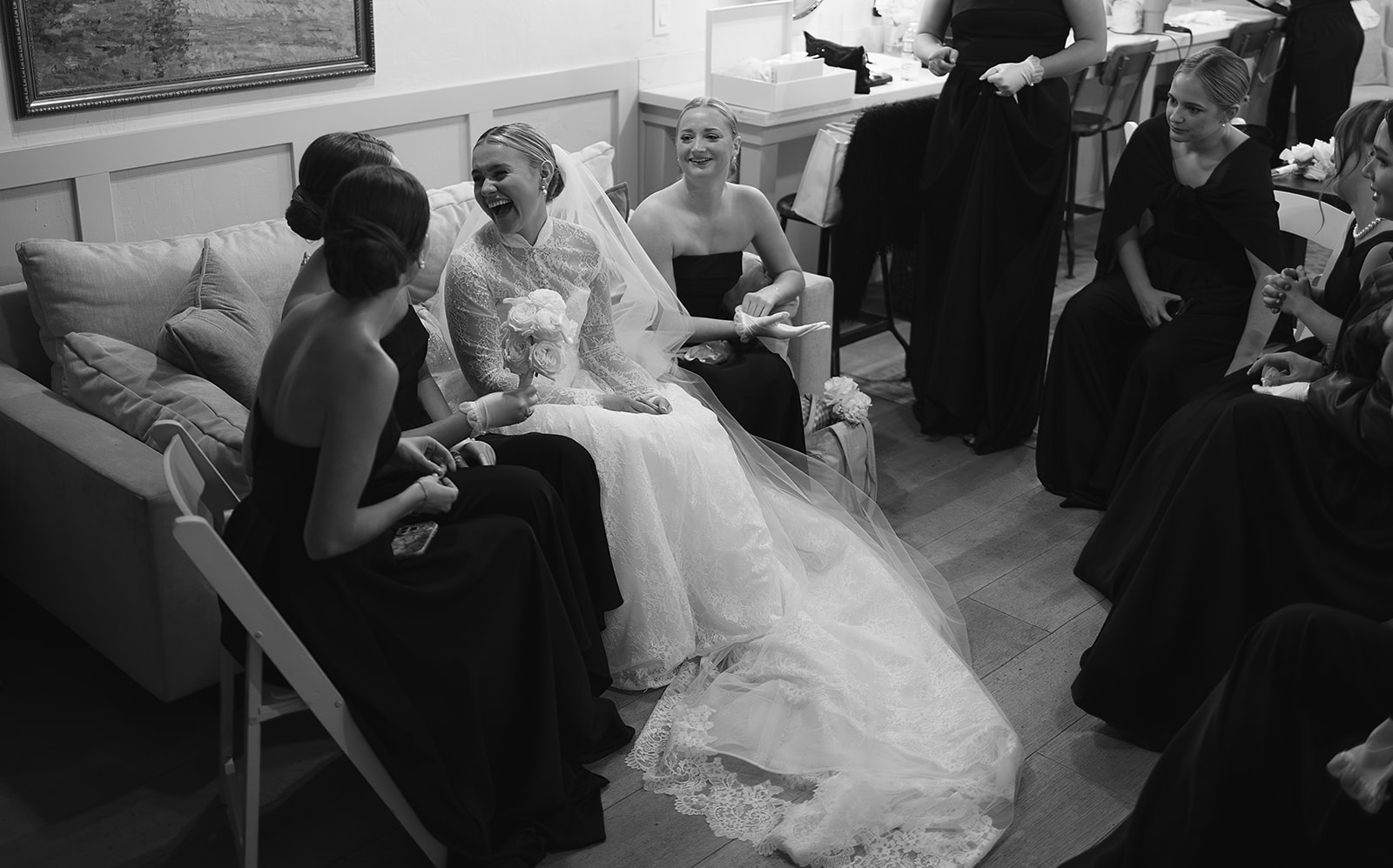 Bride having a special moment with bridesmaids in bridal suite before wedding at The Woodland in Phoenix.