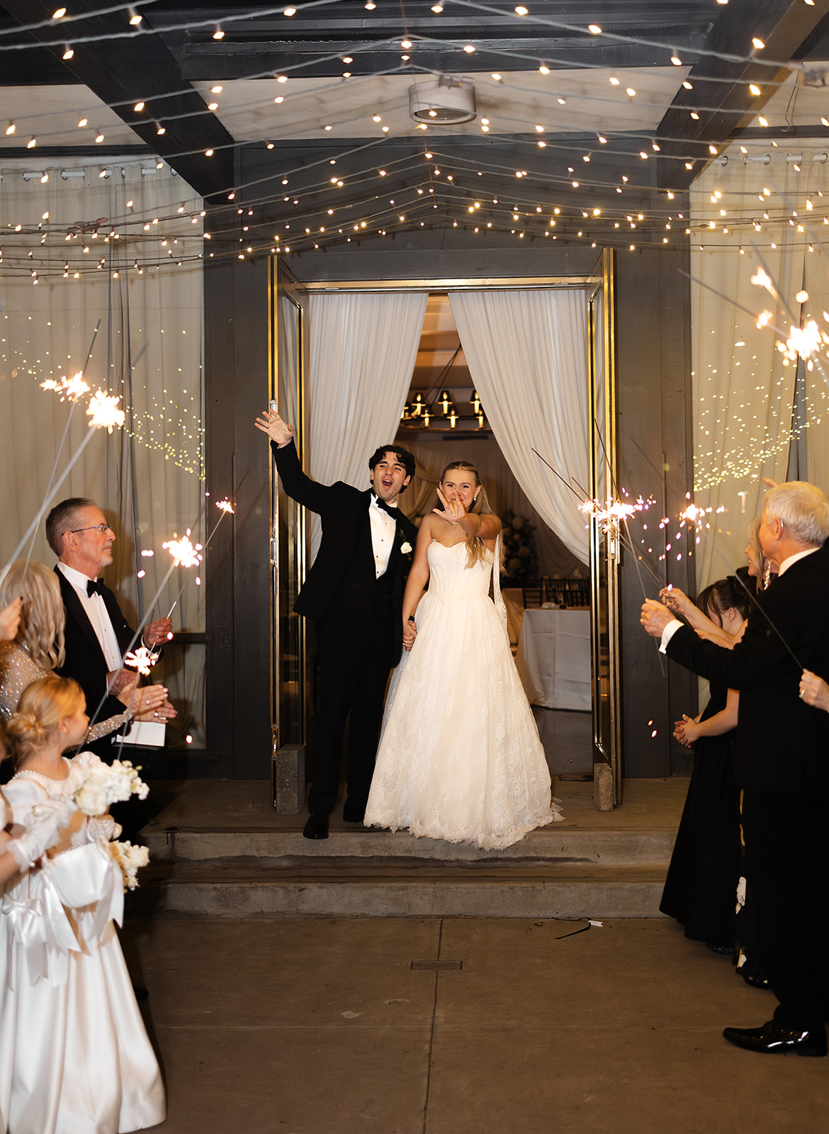 Newlyweds walking through sparkler exit at Phoenix destination wedding