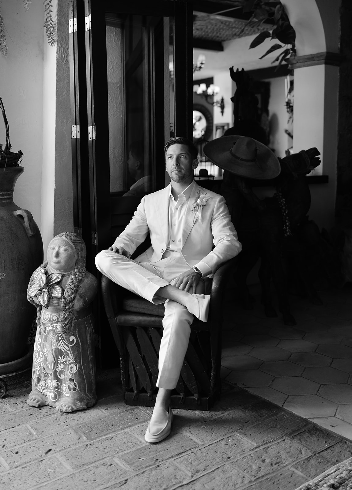 Groom getting ready near oceanfront terrace at Mexico destination wedding
