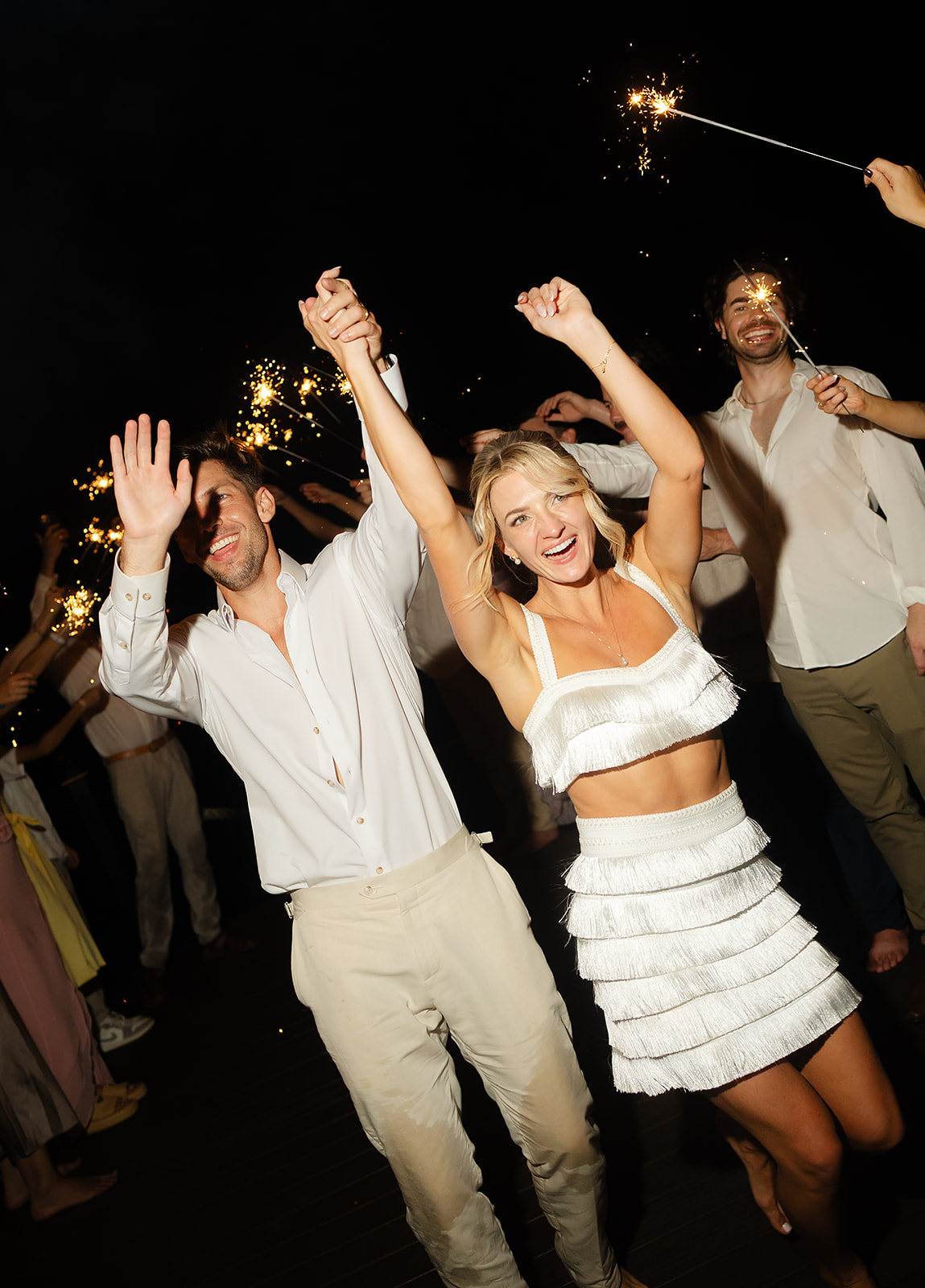 Sparkler moment near shoreline at Puerto Vallarta wedding