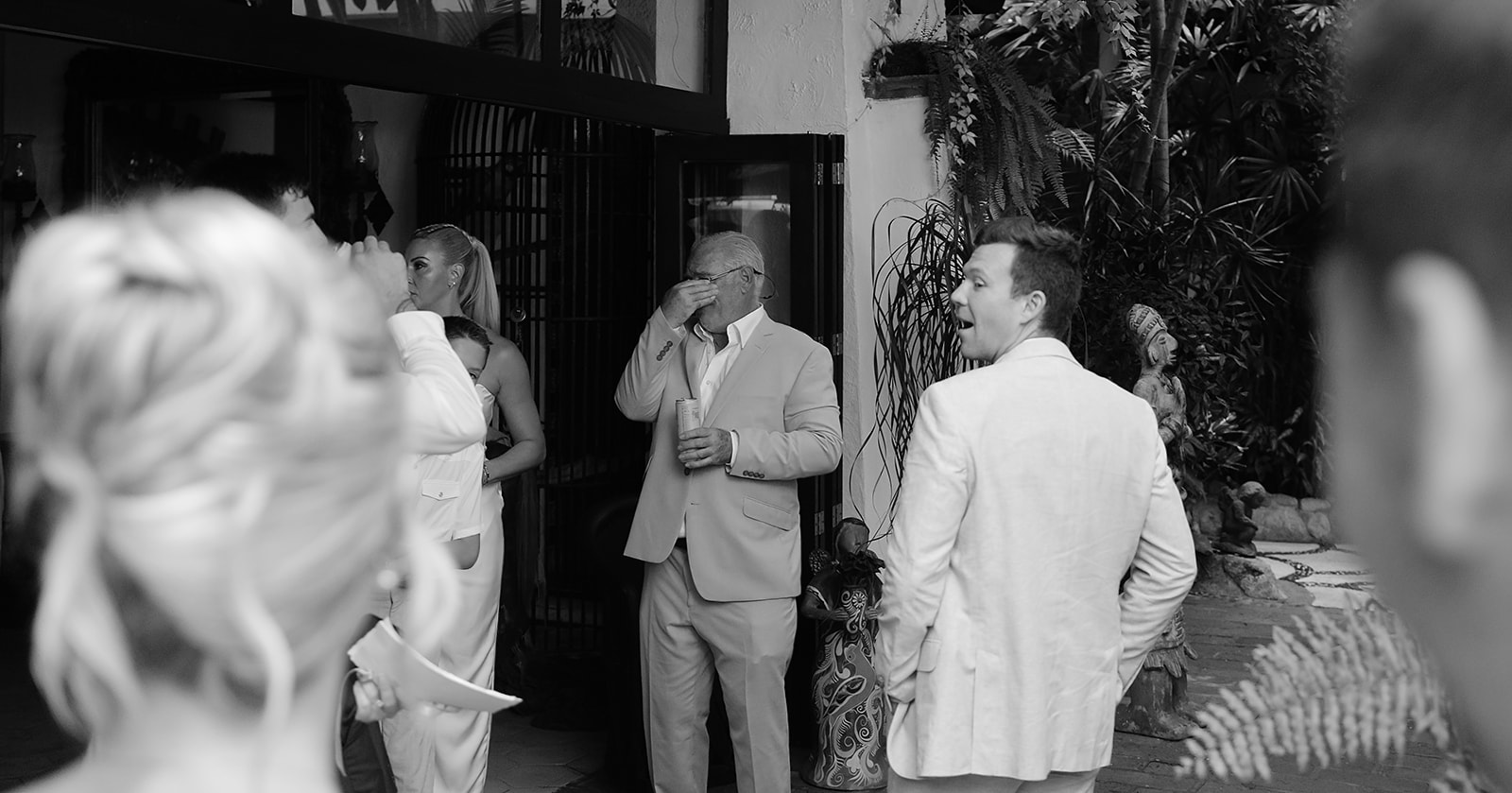Candid moment of family seeing bride at wedding in Mexico