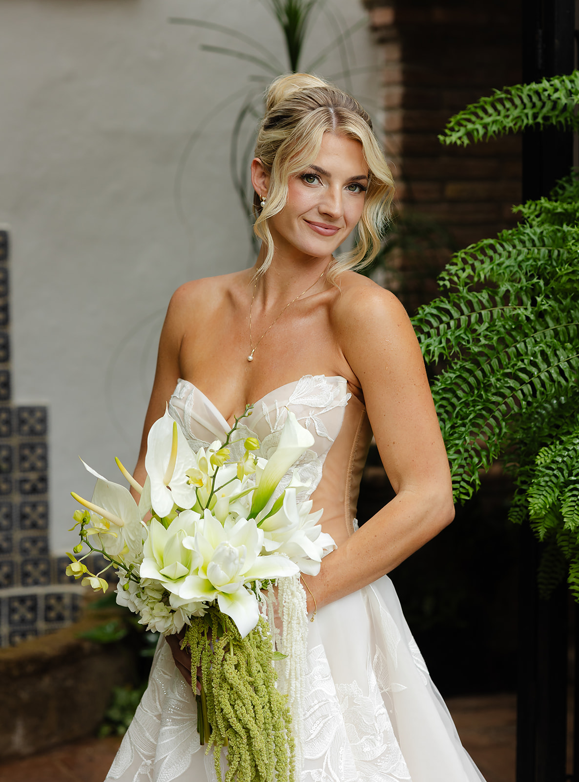 Classic portrait of bride holding her bouquet at wedding in Mexico