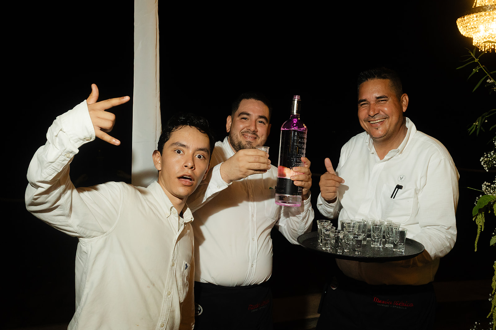 Tequila shots being poured for guests during dance floor celebration