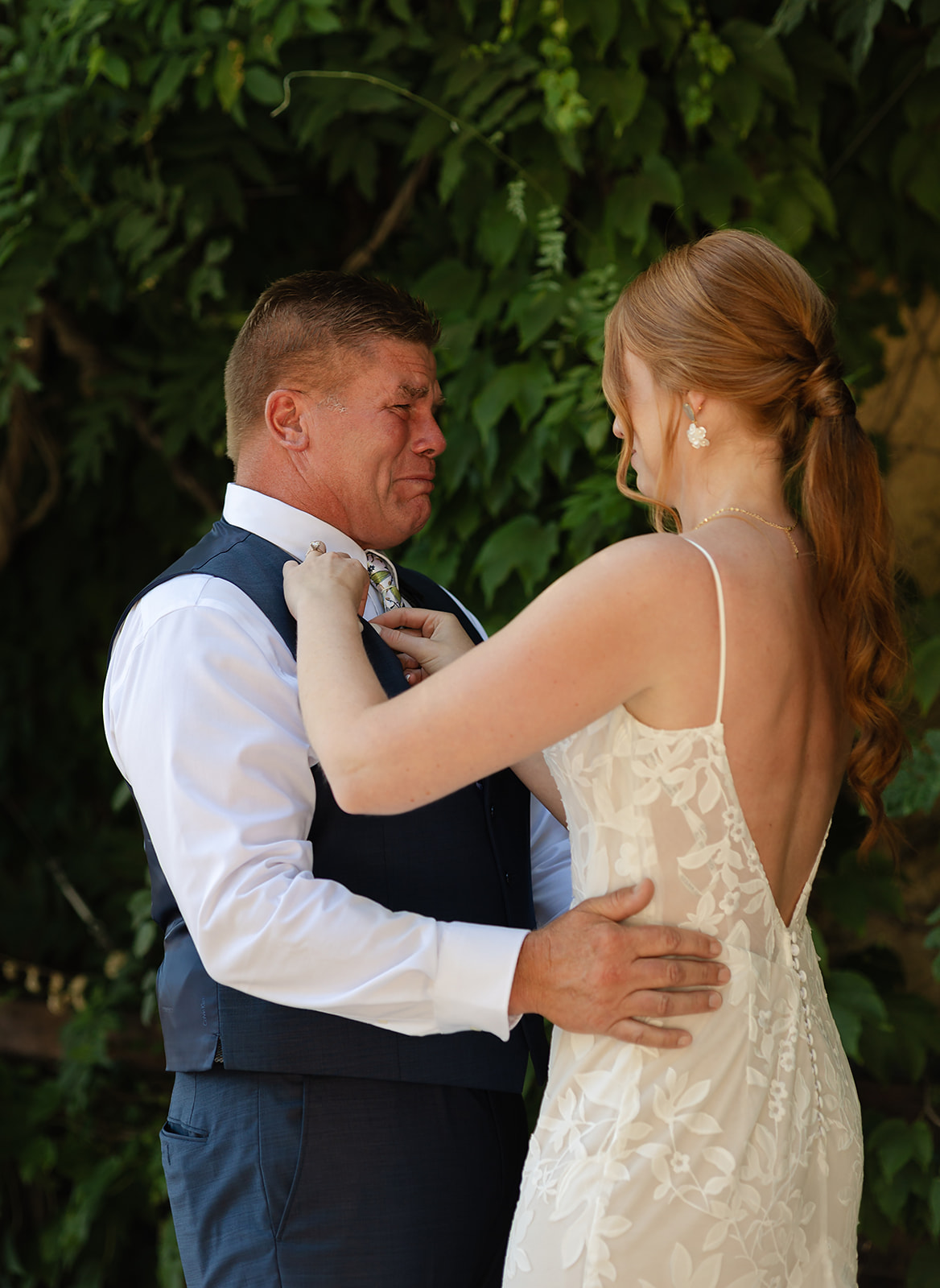 Emotional moment between bride and her dad at intimate vineyard wedding