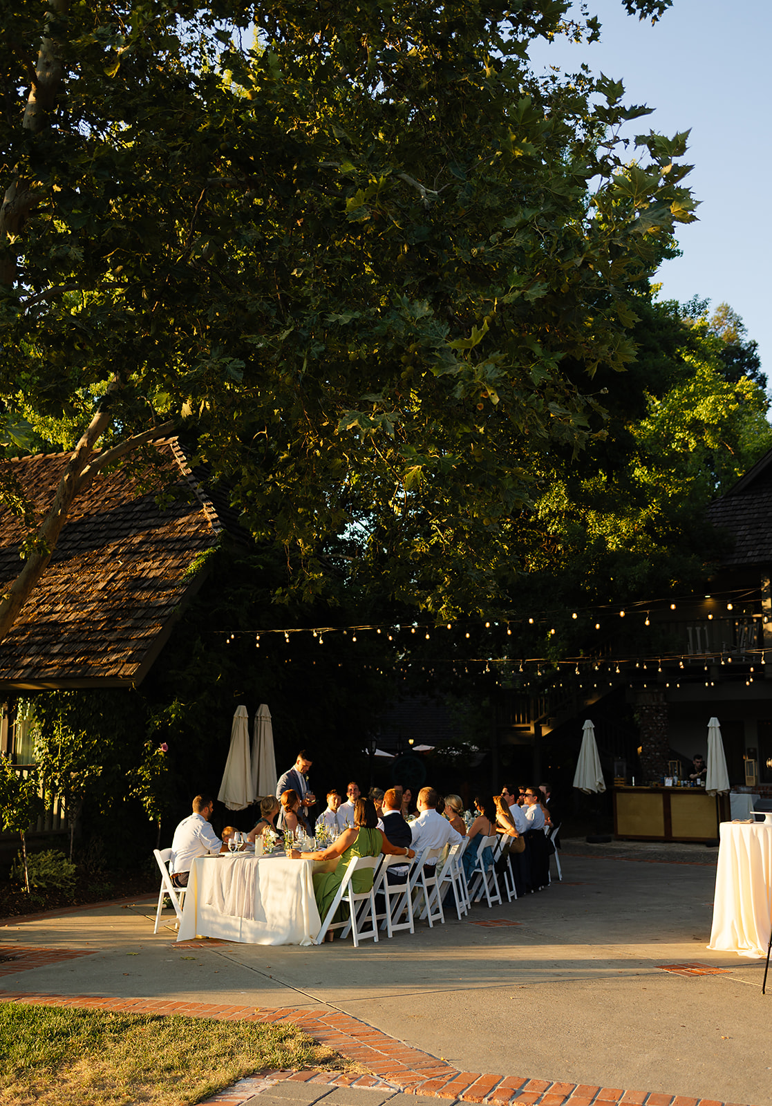 Warm evening light over outdoor reception space at Harvest Inn