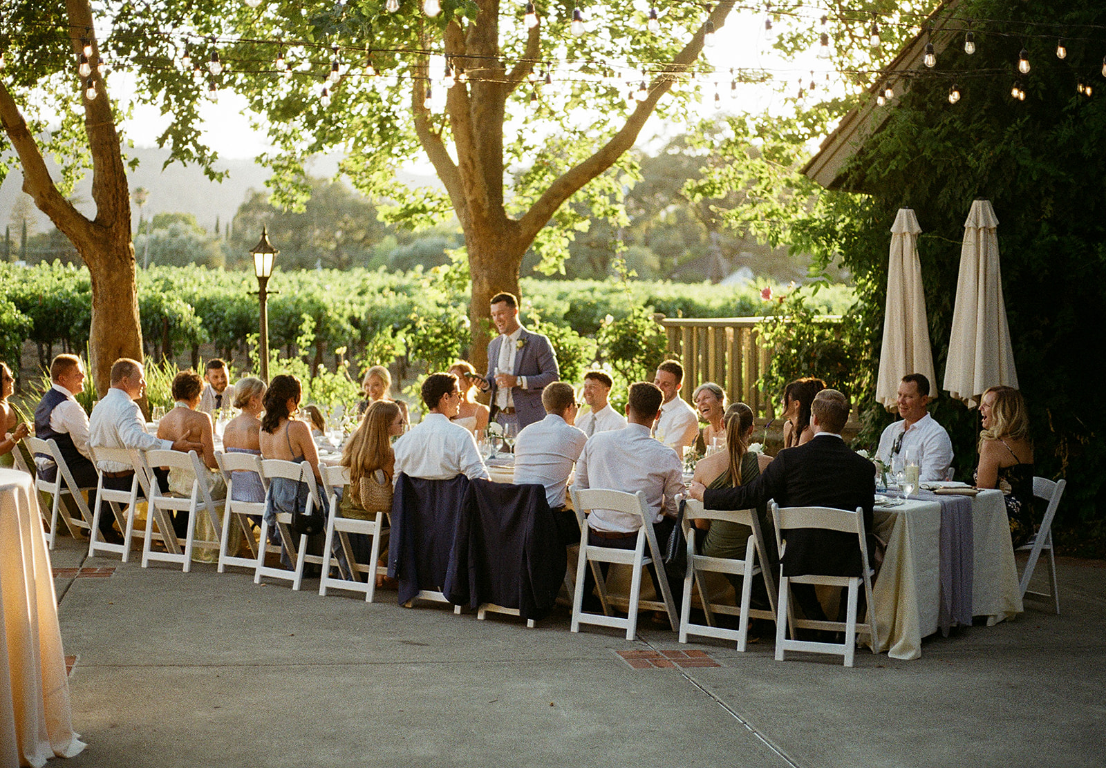 Film candid of couple interacting with guests during reception